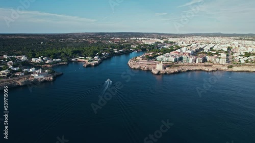 Wallpaper Mural Aerial drone view of people having a good time by the beach with turquoise water. Tourists enjoy Cala Macarelleta and Macarella on the Balearic Islands, Spain, swimming and sailing yachts and boats. Torontodigital.ca