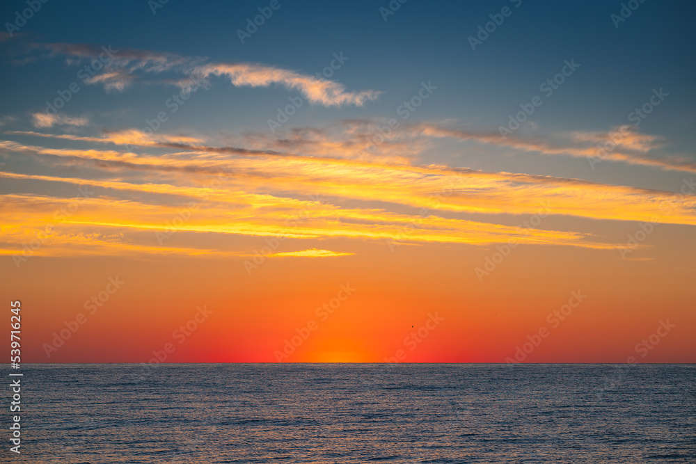 Beautiful sunrise over the sea water