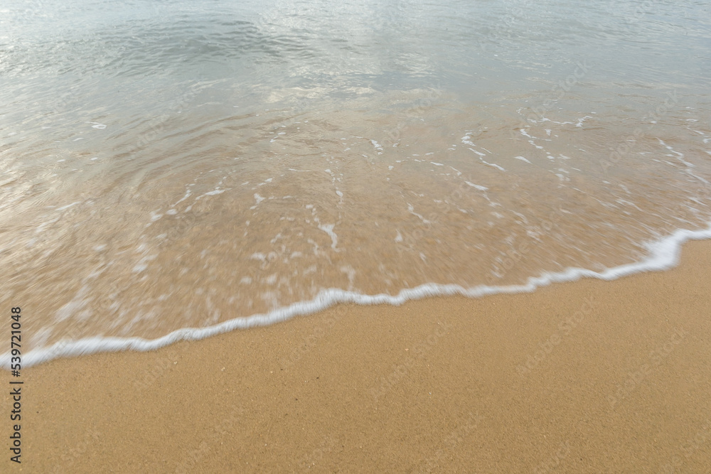 Beautiful beach with the smooth foam of sea in the morning of Rayong province Thailand