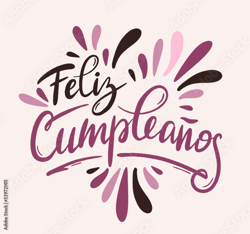 Happy birthday in Spain.  Lettering in Spanish with splashes and curls. Vector illustration