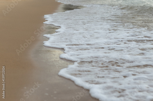 Beautiful beach with the smooth foam of sea in the morning of Rayong province Thailand