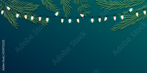 christmas background with fir branches fairy light and copy space