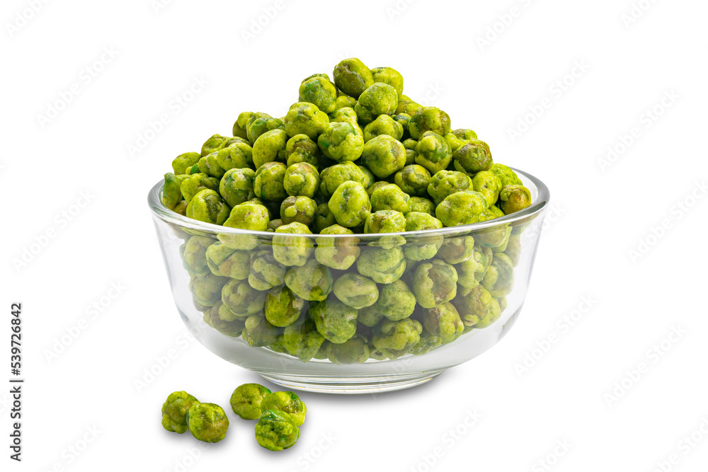 Closeup view pile of dried crispy spicy wasabi coated green peas in transparent glass bowl isolated on white background with clipping path. Closeup view pile of dried crispy spicy wasabi coated green peas in transparent glass bowl isolated on white background with clipping path.