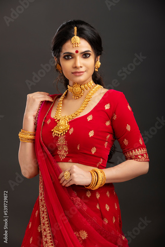 Pretty Indian young Hindu Bride portrait in studio light.