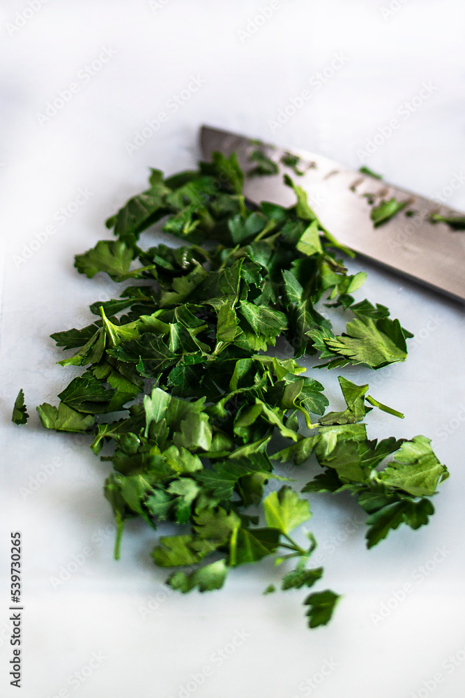 Italian pasta with baby squid and cuttlefish ink, cooking process, chopped greens Italian pasta with baby squid and cuttlefish ink, cooking process, chopped greens
