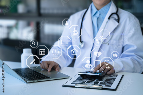 Doctor hold tablet, conduct financial transactions with calculate expenses - income and data documents, put on the desk in the morning.