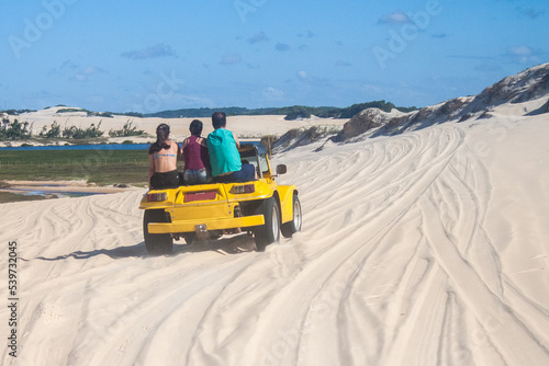 BRAZIL, NATAL - AGO 4, 2017: Colored Buggy ridding in dunes of Genipabu