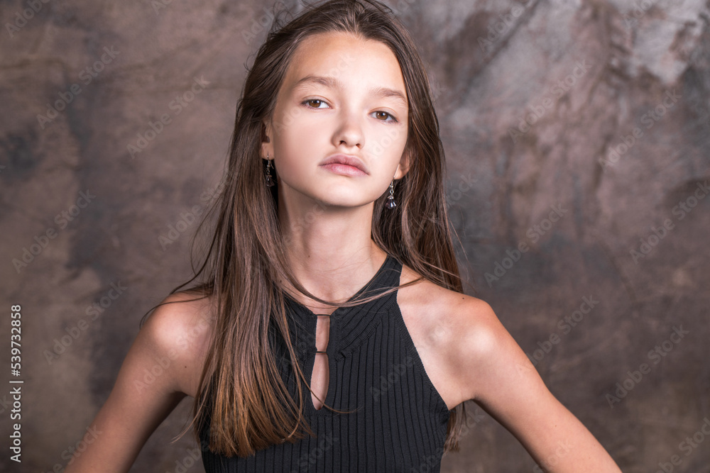 Fototapeta premium Studio portrait of a young teen girl