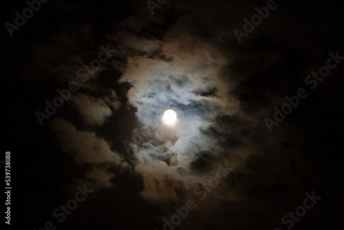 Moon in the night sky with clouds for Halloween, harvest or fall, blood moon 