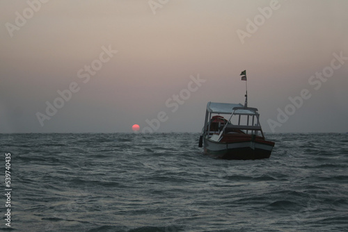 VIew of sunset with boats with no people in São Luis city Brazil