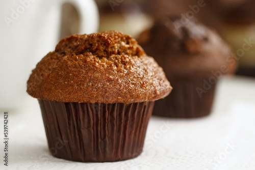 Canvas-taulu Fresh raisin bran muffin with blurred background