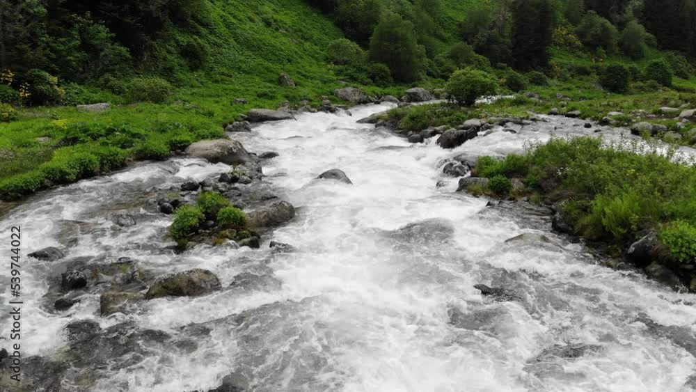 Stream water running through green valley. View from the drone on the river and the valley with rocky banks. Aerial topdown view
Stream water running through green valley. View from the drone on the river and the valley with rocky banks. Aerial topdown view