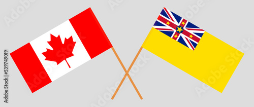 Crossed flags of Canada and Niue. Official colors. Correct proportion