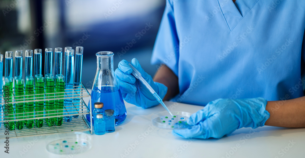 Female scientist researcher conducting an experiment working in the chemical laboratory. virus.. Female scientist researcher conducting an experiment working in the chemical laboratory. virus..