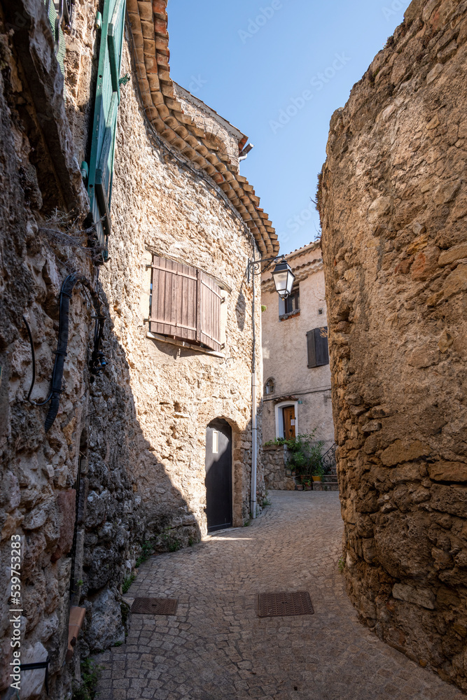 Street of Tourtour with Stone houses topped with round tiles, a very touristic village in South of France. Tourtour nicknamed is “The village in the sky of Provence”