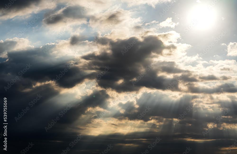 Amazing dramatic cloudy sky landscape with rays bursting out from the clouds. Iconic view of the sky in the morning. Nature landscapes around the world. Amazing dramatic cloudy sky landscape with rays bursting out from the clouds. Iconic view of the sky in the morning. Nature landscapes around the world.