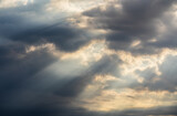 Amazing dramatic cloudy sky landscape with rays bursting out from the clouds. Iconic view of the sky in the morning. Nature landscapes around the world.