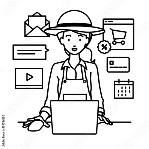 デスクで座ってPCでネットショップやマーケティングの仕事をしている調理師の女性