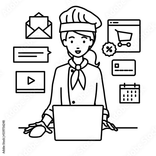 デスクで座ってPCでネットショップやマーケティングの仕事をしている調理師の女性