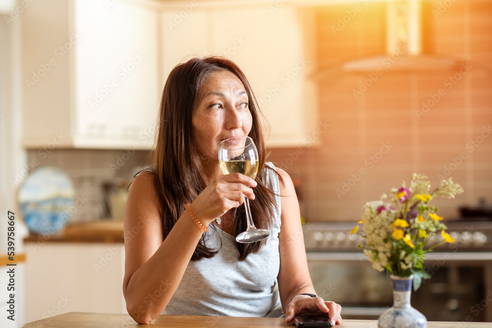 Asian smile woman talking to friends with glass of wine at home Asian smile woman talking to friends with glass of wine at home