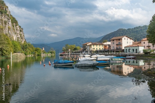 Village of Lavena Ponte Tresa with reflections on Lake Lugano in Varese, Lombardy, Italy photo