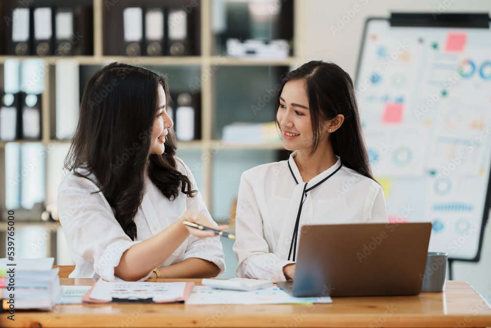 Asian business people meeting with new startup project pointing graph discussion and analysis data charts and graphs.Business finances and accounting concept. Asian business people meeting with new startup project pointing graph discussion and analysis data charts and graphs.Business finances and accounting concept.