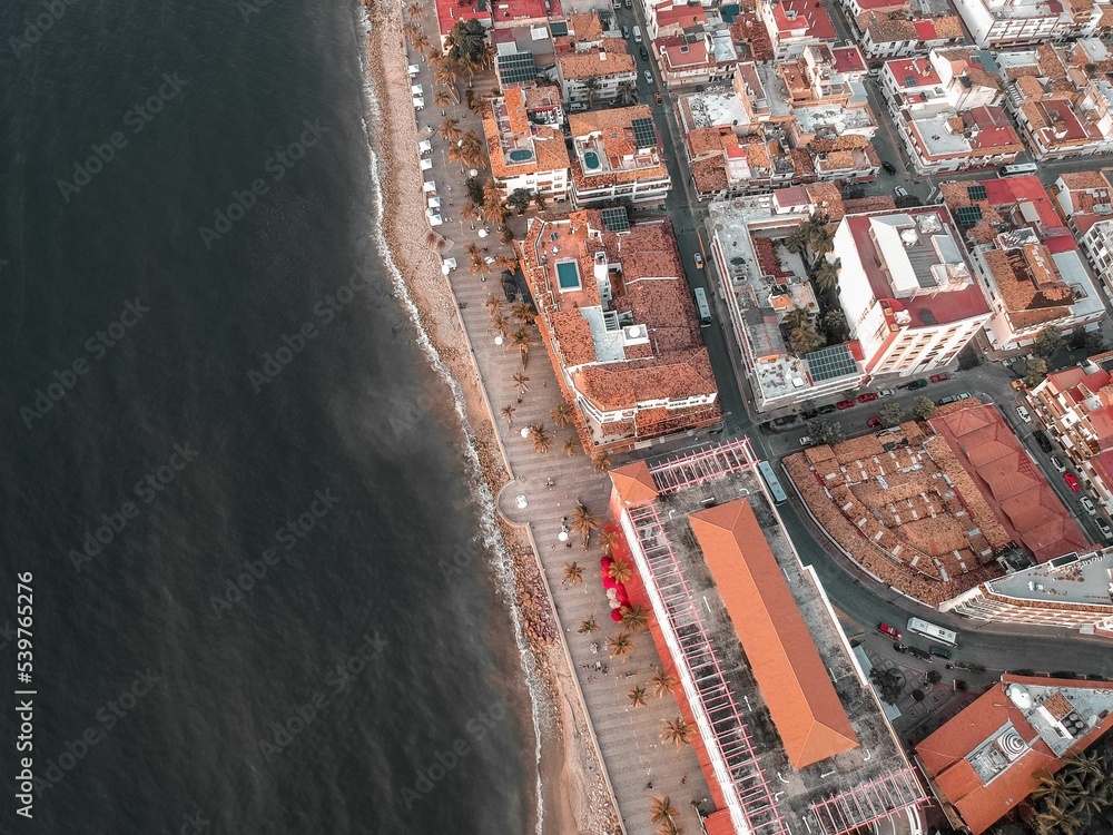 Naklejka premium Aerial shot of Malecon of Puerto Vallarta with some traditional houses and streets