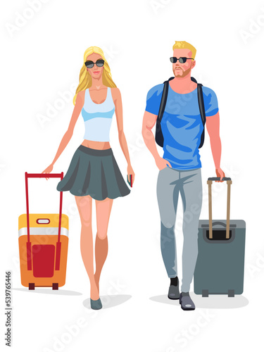 Attractive woman and her boyfriend walking with their luggage. Tourist couple carrying their bags.