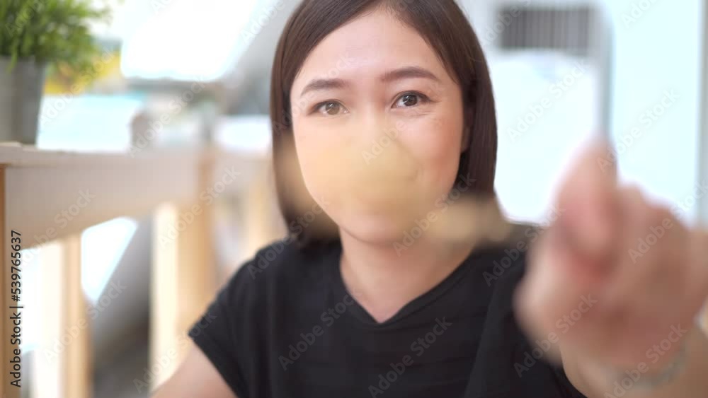 Woman enjoy eating spaghetti carbonara in the restaurant. Woman enjoy eating spaghetti carbonara in the restaurant.