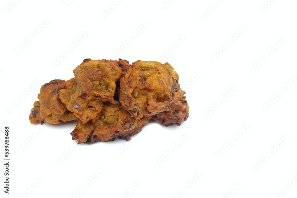 Masoor Dal Pakoda or Red Lentil Vada on Isolated on White Background with Copy Space in Horizontal Orientation Masoor Dal Pakoda or Red Lentil Vada on Isolated on White Background with Copy Space in Horizontal Orientation
