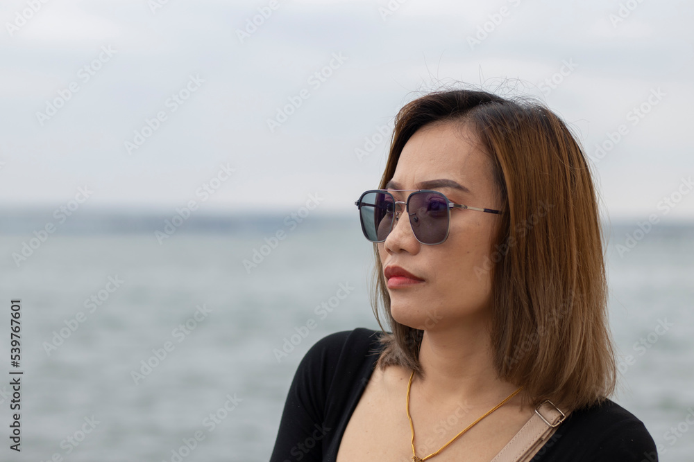 Beautiful Asian woman with blurred background Beautiful Asian woman with blurred background
