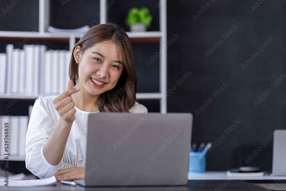 Happiness Entrepreneur beautiful business asian young woman working with laptop at workplace, Small Business Startup, online banking tax, accounting, financial concept. Happiness Entrepreneur beautiful business asian young woman working with laptop at workplace, Small Business Startup, online banking tax, accounting, financial concept.
