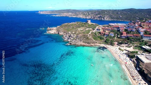 Italy summer holidays. Sardegnia island . village Santa Teresa di Galura in northern part with turquoise sea and defencive old tower 