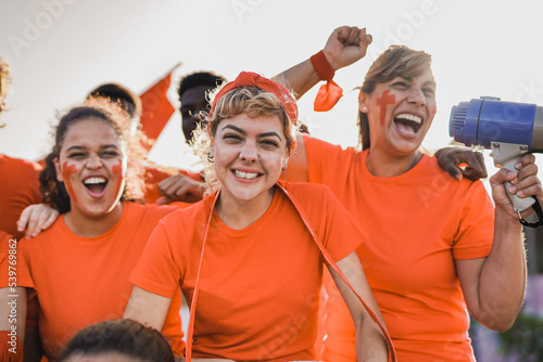 Tablou pe pânză Multiethnic football supporter fans watching soccer match at stadium -  People w