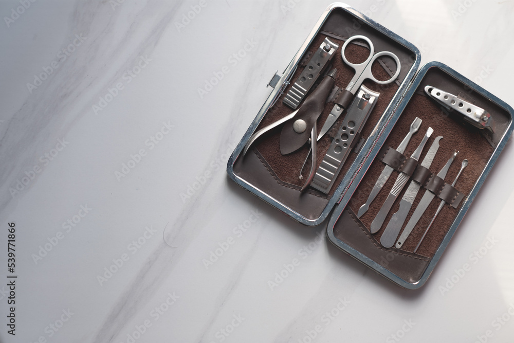 Manicure nails and pedicure tool set concept, cosmetic accessories for nails, scissors, pusher cuticle and nail file, cleaning nails for protection dirt bacteria in nails Manicure nails and pedicure tool set concept, cosmetic accessories for nails, scissors, pusher cuticle and nail file, cleaning nails for protection dirt bacteria in nails