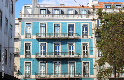 Exterior view of beautiful historical buildings in downtown Lisbon, Portugal Europe. Turquoise house with ornaments on a Mediterranean street.