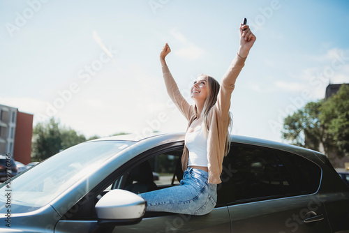car driver woman happy owner of a new car