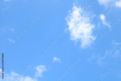 This shot of a bright sky with white clouds is perfect for background and textures.