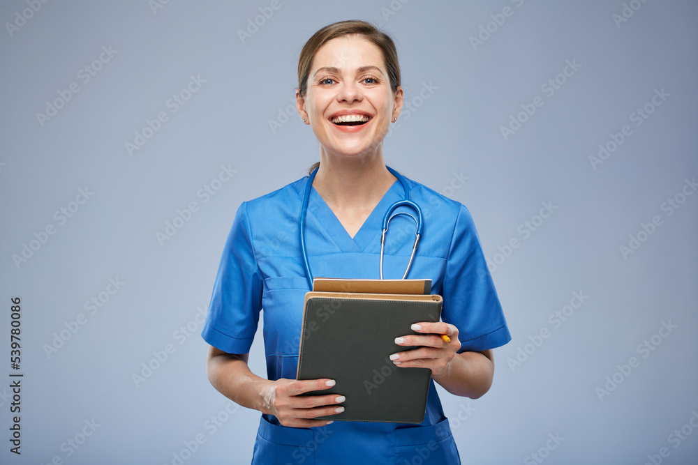 Nurse or doctor woman holding books. Isolated female portrait. Nurse or doctor woman holding books. Isolated female portrait.