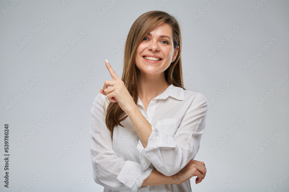 Portrait of smiling woman with big wide smile pointing finger up. Portrait of smiling woman with big wide smile pointing finger up.
