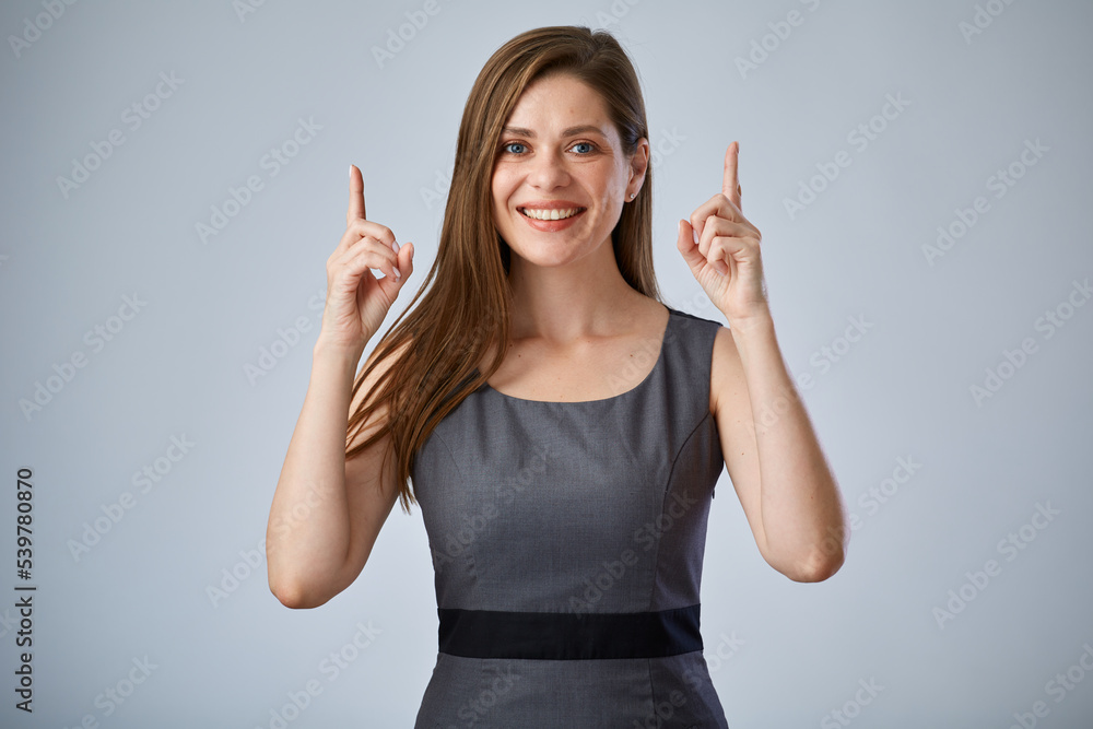 Smiling executive woman pointing two fingers up. Isolated portrait female business person. Smiling executive woman pointing two fingers up. Isolated portrait female business person.