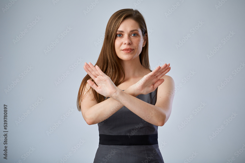 Young woman gesturing stop anger with hands. isolated female portrait.