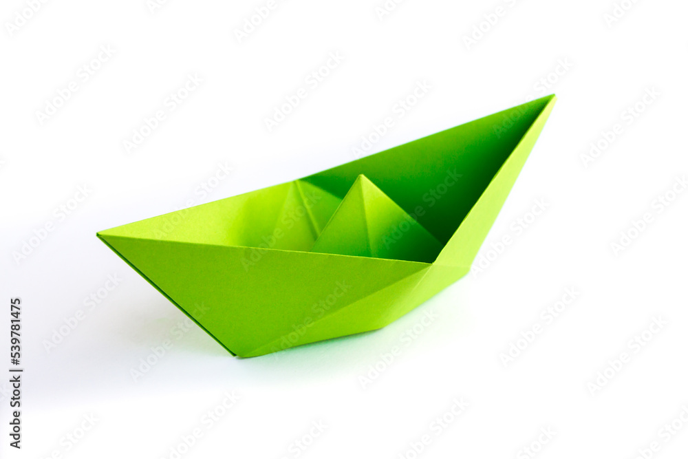 Green paper boat origami isolated on a white background Green paper boat origami isolated on a white background