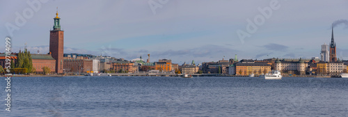 Panorama view over down town, Town City Hall, Governmental Buildings, commuter boat, old town Gamla stan a sunny autumn in Stockholm