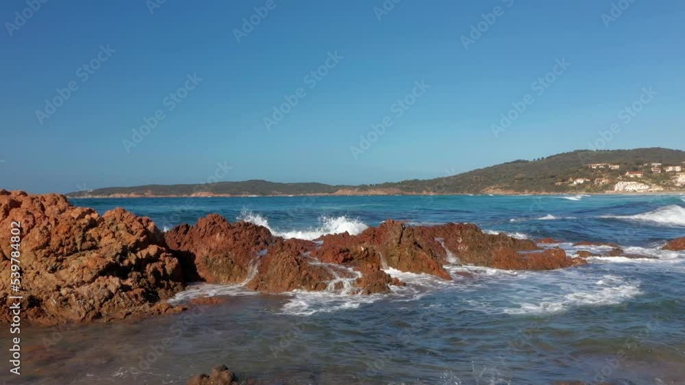Pero beach of Cargese in Corsica on a sunny day. Drone aerial view of the Mediterranean Sea and sand beach with rocks at sunrise Pero beach of Cargese in Corsica on a sunny day. Drone aerial view of the Mediterranean Sea and sand beach with rocks at sunrise