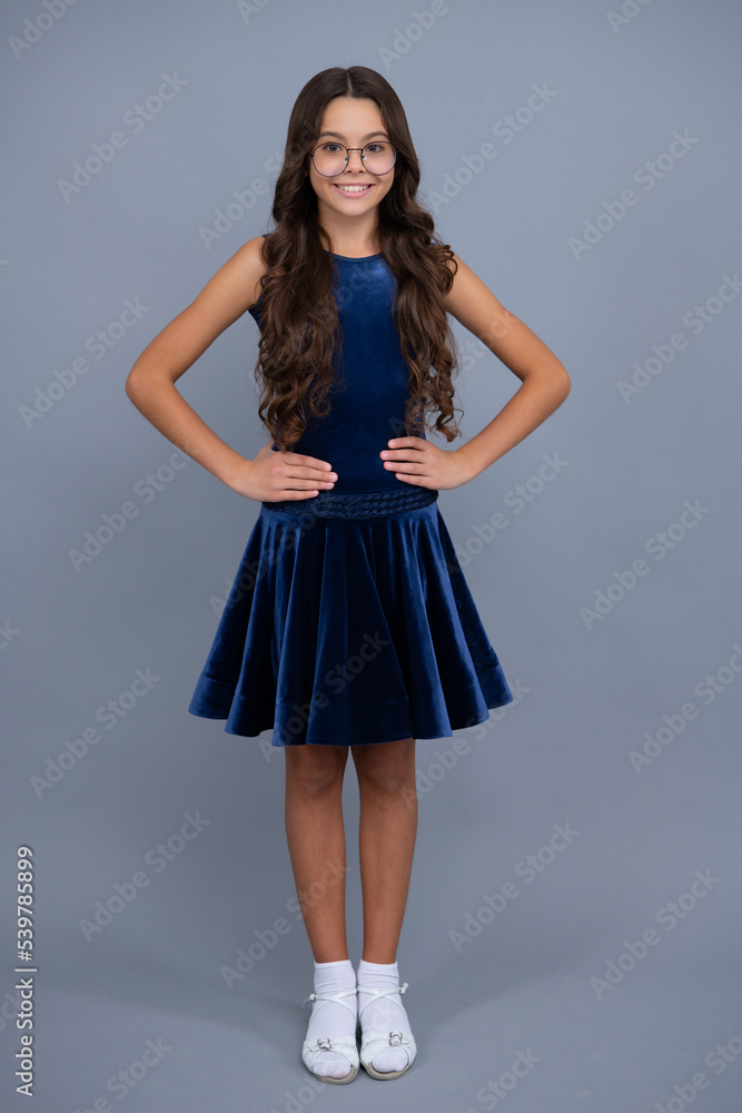 Full length of teenager child girl wearing ball dress. Happy girl face, positive and smiling emotions. Candid lovely child girl wear skirt, good look clothes.