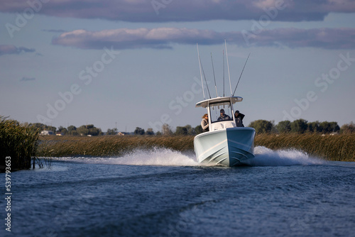 Speeding center-console fishing boat.