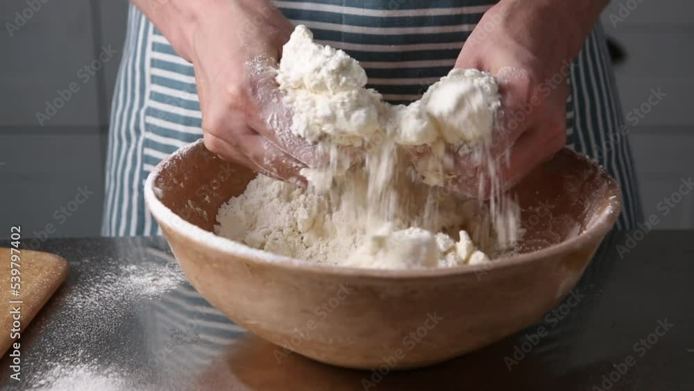 Hands making dough in bowl homemade bread Hands making dough in bowl homemade bread