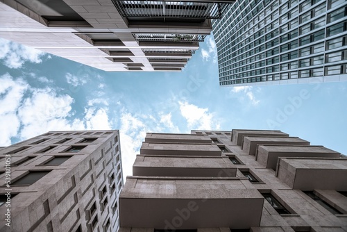 Undershot of skyscrapers with a cloudy sky background photo