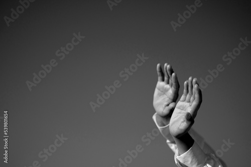 two lover raise hand to the sky as a symbol of love in blackk and white photo